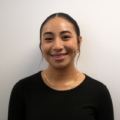 Leslie Cerano, B BOLD(ER) intern at Clearinghouse CDFI, smiling confidently in a professional setting.