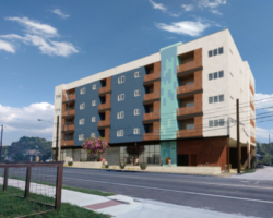 Exterior view of The Chicon condominiums showcasing its contemporary design with blue and wood facade, situated in a vibrant urban neighborhood.